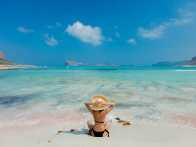 girl in black bikini and with hat on Balos beach a lady at Balos beach