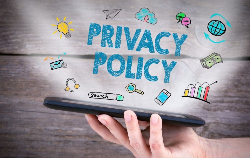 a picture with some icons and a phrase with blue letters which says "Privacy Policy"